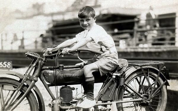 Little boy on a 1910 Cleveland motorcycle