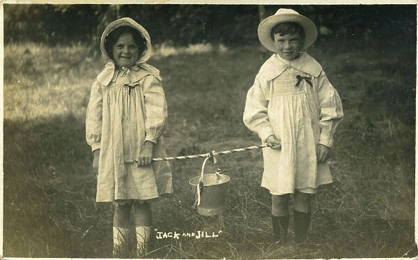 A little boy and little girl dressed up as nursery rhyme characters, Jack and Jill