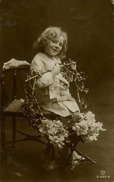 Little girl with garland of flowers
