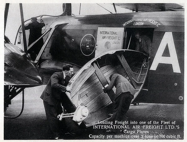 Loading freight into one of the Fleet of International Air Freight Ltd.s Cargo Planes - capacity per machine over 2 tons or 700 cubic ft. Date: circa 1920s
