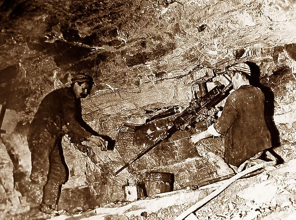 Machine hole drilling in a coal mine