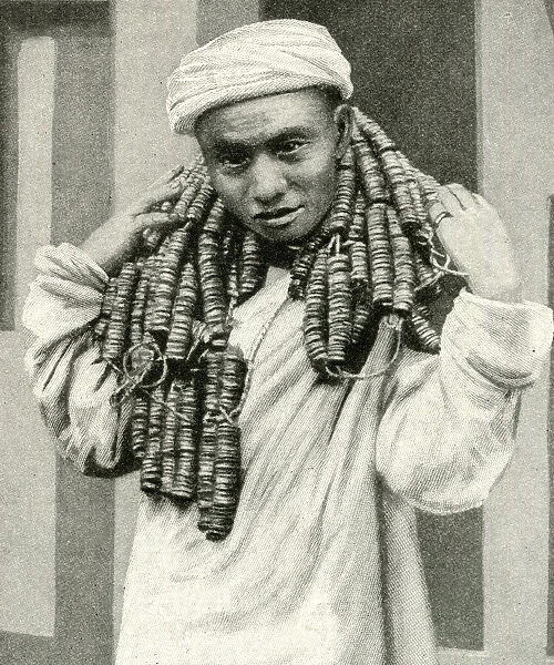 Man carrying coins round his neck, China, East Asia