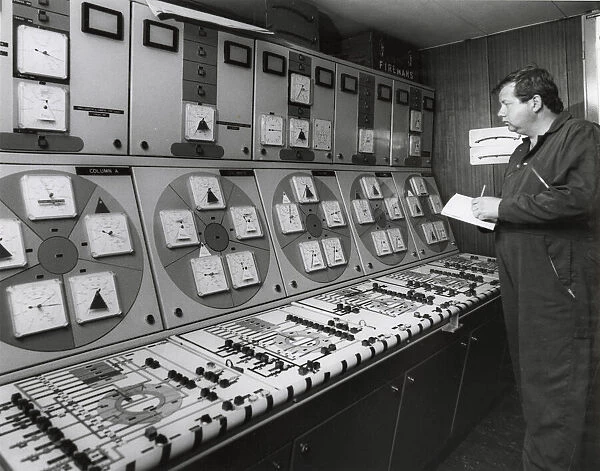 Man at work in an oil rig control room