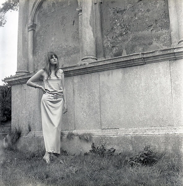 Model posing in a graveyard