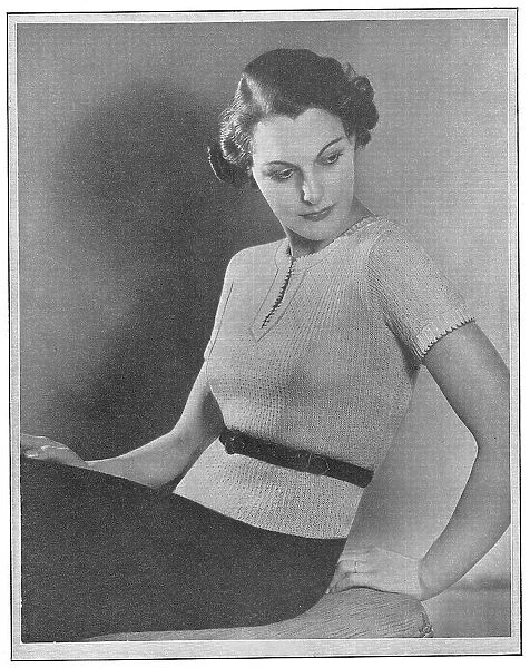 Model wearing a short-sleeved knitted spring jumper Date: 1936