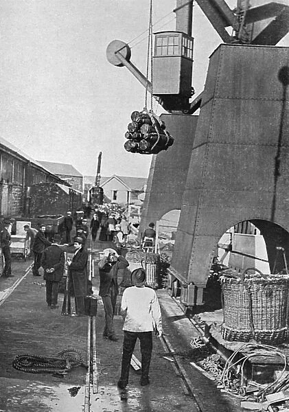 Munitions being loaded onto battleship, WW1