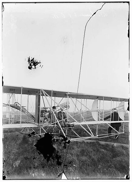Orville seated in Wright airplane with Albert B. Lambert bef