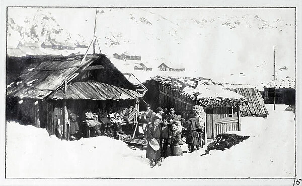 People and huts in the snow, Gnatong, Sikkim, India, from a fascinating album which reveals new details on a little-known campaign in which a British military force brushed aside Tibetan defences to capture Lhasa, in 1904
