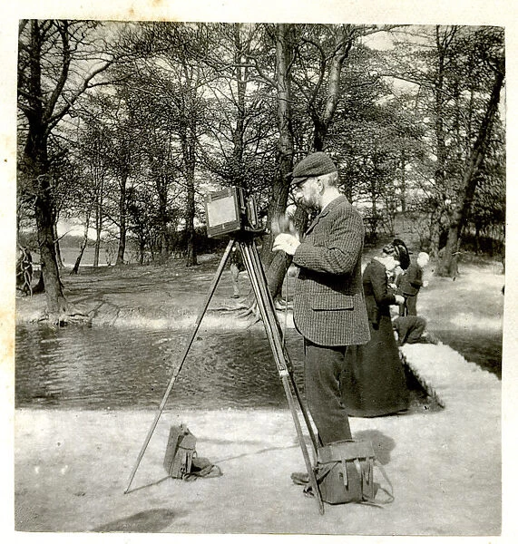 Photographer with camera and tripod