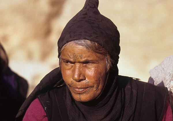 Portrait of mature Bedhouin Syrian woman with facial tattoos