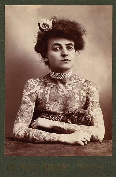 Portrait of a woman showing images tattooed or painted on he