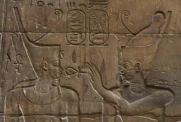 Relief depicting Egyptian divinity giving the Ankh to a phar