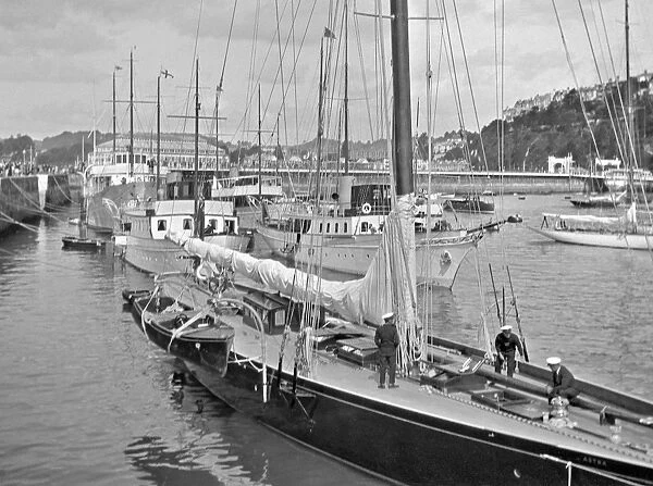 Scene in a harbour with yacht in foreground