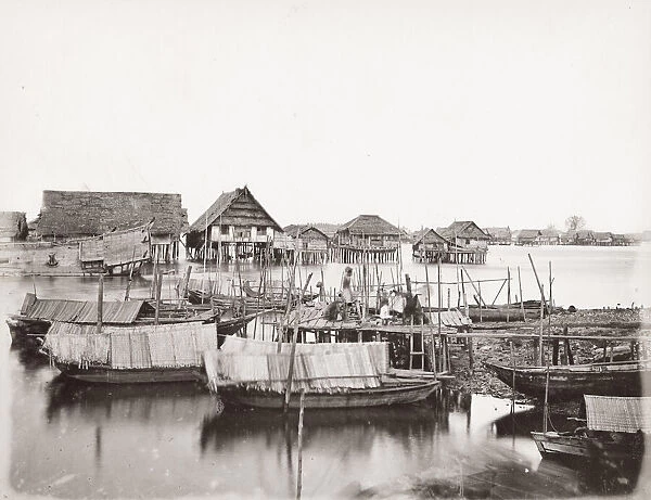 SE Asia, probably Malay peninsula, villages houses on stilts, rive boats