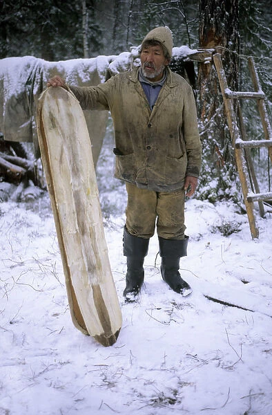 Selkup Man (North Siberia minority) shows his wooden