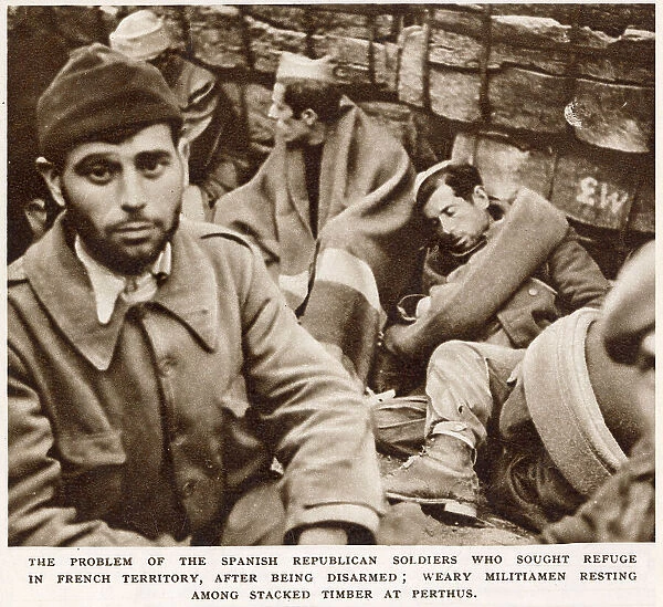 Showing men, formerly soldiers of the Republican Army, who became refugees at the end of the Spanish Civil War, in Perthus, France. When the Nationalist Army finally won the Spanish Civil War, in 1939