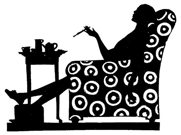 Silhouette of a woman in an armchair