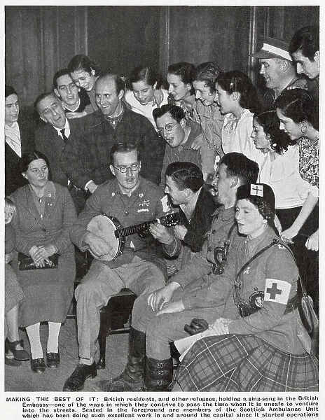 A sing-song in the British Embassy at Madrid, during the early stages of the Spanish Civil War, 1936. A number of British citizens in Madrid had sought refuge in the Embassy