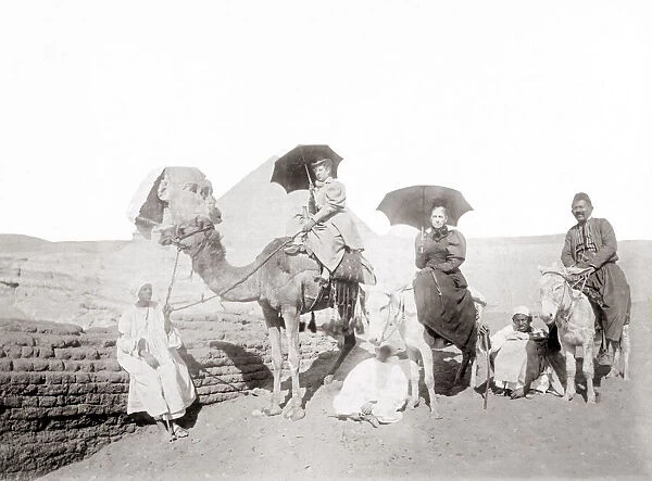 Tourists at the Sphinx with camel and donkey, Egypt, c. 1900
