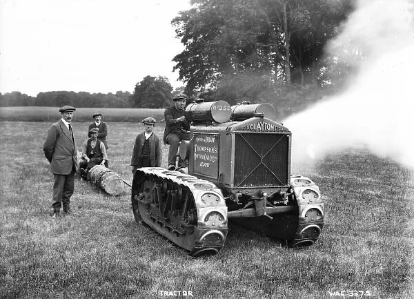 Tractor - a view of men in a field beside a motorised Clayton tractor with a lot of smoke