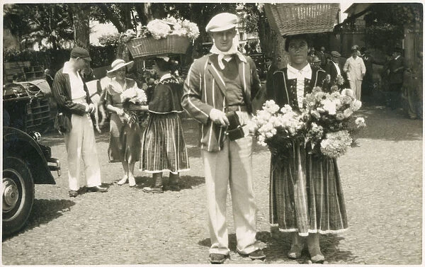 Traditional flower sellers in Madeira, Portugal. Date: circa 1930s