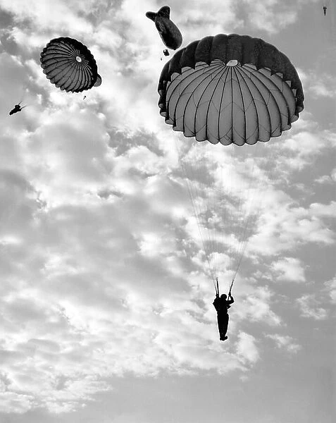 Trainee paratroops descending from a Barrage Balloon