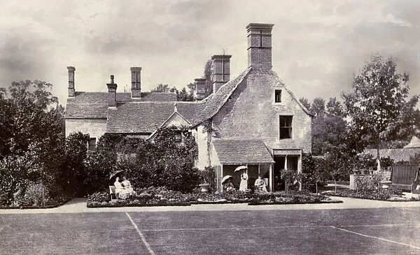 Victorian family group in the garden of a country house