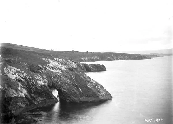 View of an unidentified coastal scene showing an eroded coas