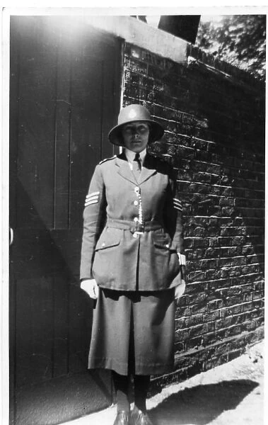 Woman police officer posing in uniform, London, WW2