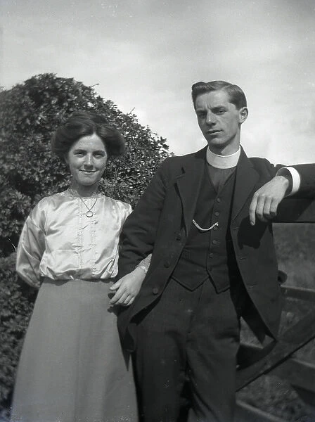 Young clergyman with young woman