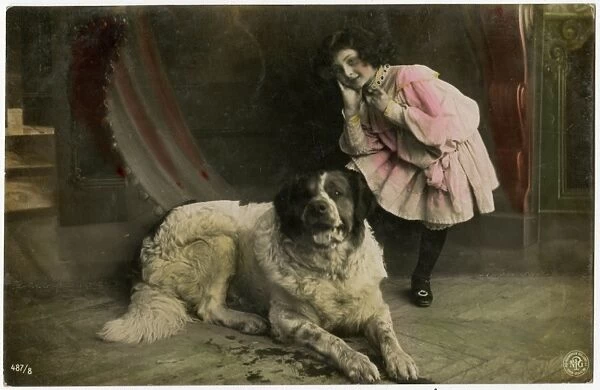 Young French girl with a huge St Bernard Dog
