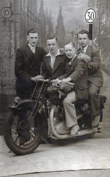 Young men on 1920s Coventry Eagle motorcycle