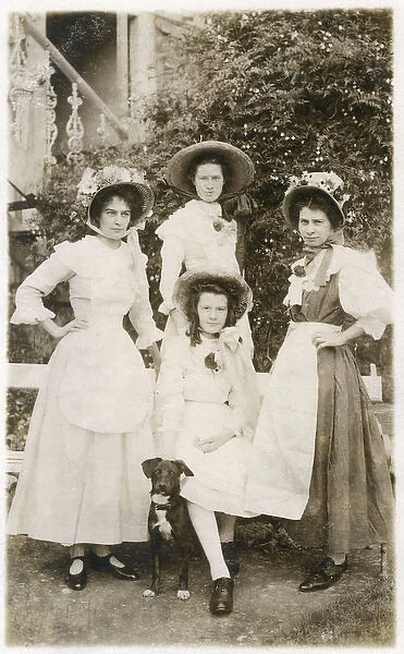 Four young women and a dog in a garden