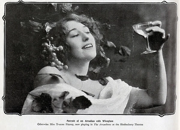 Yvonne Fitzroy, actress, theatrical portrait in costume in The Arcadians, Shaftesbury Theatre. Captioned, Arcadian with wine glass'. From an article, London Night's Entertainments'. Yvonne Fitzroy