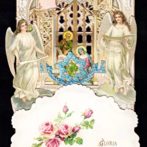 Two angels with nativity scene on a Christmas card