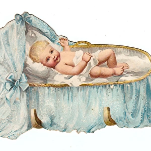 Baby in a cradle on a cutout greetings card