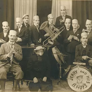 A band, most of whom are wearing disguise of heavy eyebrows and moustaches