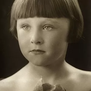 A beautiful studio portrait photograph of a 5 year-old girl