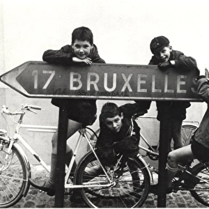 Belgian boy scouts with road sign