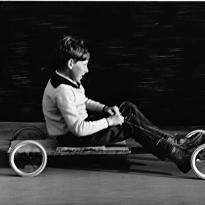 Boy on a home-made go-kart