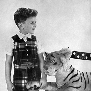 Boy in tartan shorts and waistcoat party outfit 1956