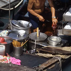 Chef prepares a Peking Duck - floating restaurant, Hong Kong