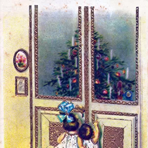 Two children gazing at a tree on a Christmas postcard