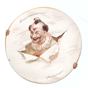 Clown with head through paper on a Christmas card