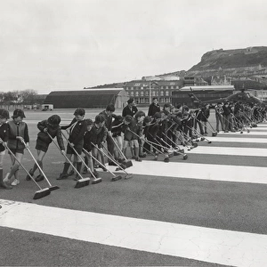 Cub Scouts sweeping runway, HMS Osprey, Portland