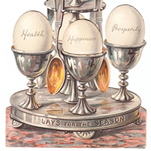 Eggcup stand with eggs on a cutout Christmas card