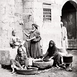 Egypt Cairo - women washing with water from a well