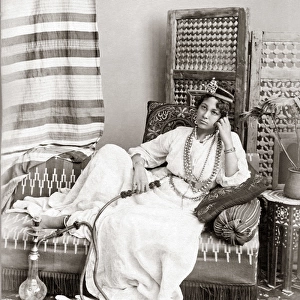 Egyptian dancer with hookah, circa 1880s