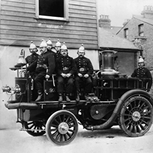 Firemen with early fire engine