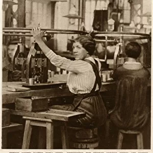 French female munitions worker making powder primers 1916